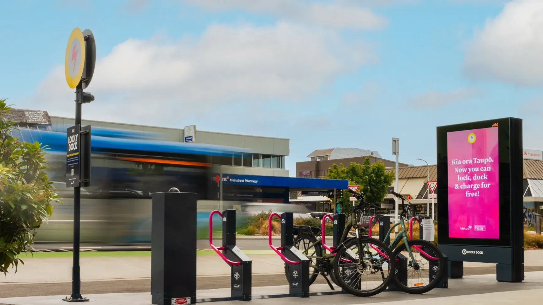 Locky Dock bike parking and e-bike charging station with a digital advertising screen at the Taupō iSite, New Zealand